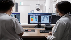 Doctors examine a chest x-ray finding generated by Lunit INSIGHT CXR