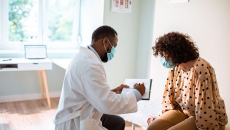 Doctor talks to patient