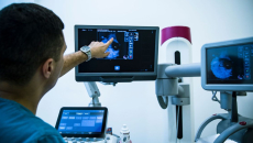 A doctor looking at a mammogram.
