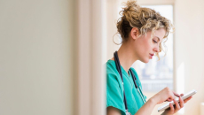 A nurse using her smartphone.