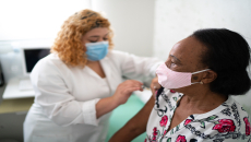 A healthcare provider administering a vaccine.