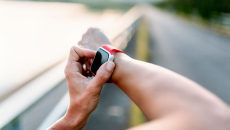 A close up of a person wearing a smartwatch