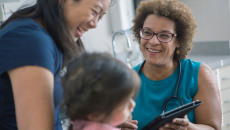 Healthcare provider with a patient and their caregiver