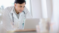 A doctor using a laptop