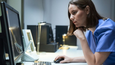 A medical professional using a desktop computer