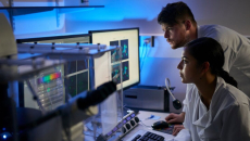 Laboratory scientists reviewing a computer-aided analysis