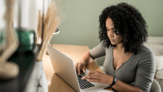 A person using a laptop.