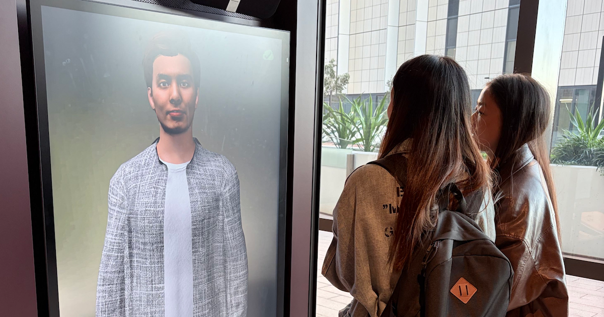 A pair of students interacting with an AI companion prototype
