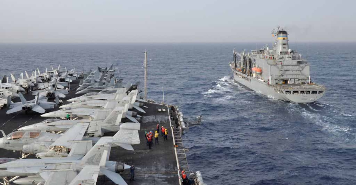 Aircraft carrier USS Dwight D. Eisenhower (CVN 69) and Military Sealift Command fleet replenishment oiler USNS Kanawha (T-AO 196) participate in a replenishment-at-sea