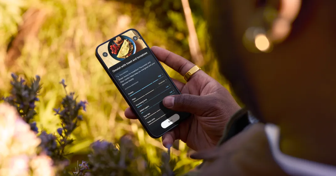 Person holding a phone that has food on the screen
Person holding a phone that has food on the screen