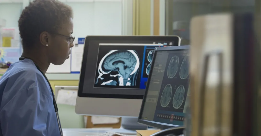 Healthcare professional reviewing imaging on a screen
Healthcare professional reviewing imaging on a screen