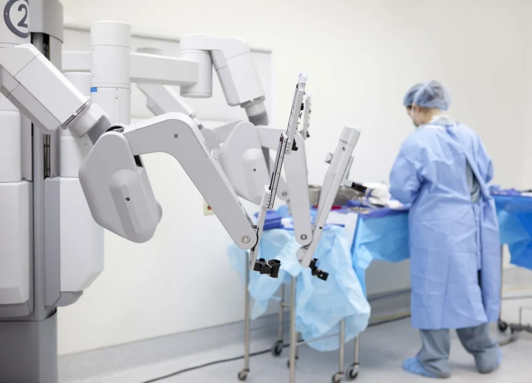 
  Technician preparing surgical robot 
