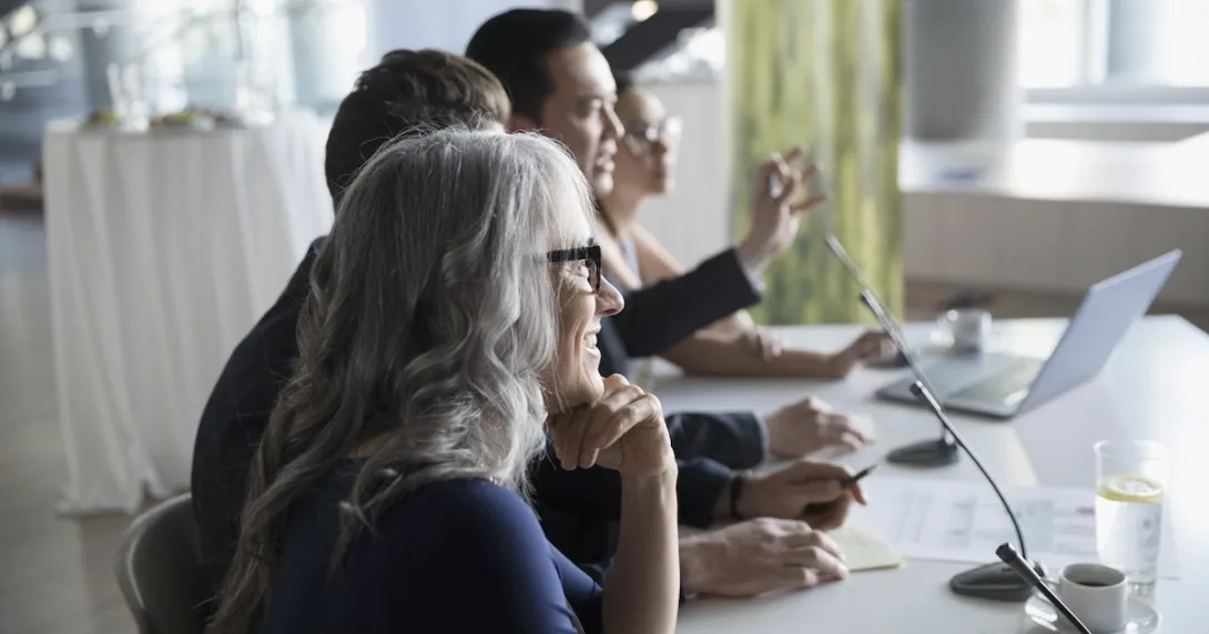 
  Executives gathered in a meeting
