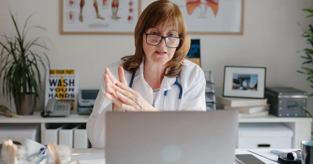 Healthcare professional interacting via laptop computer Healthcare professional interacting via laptop computer