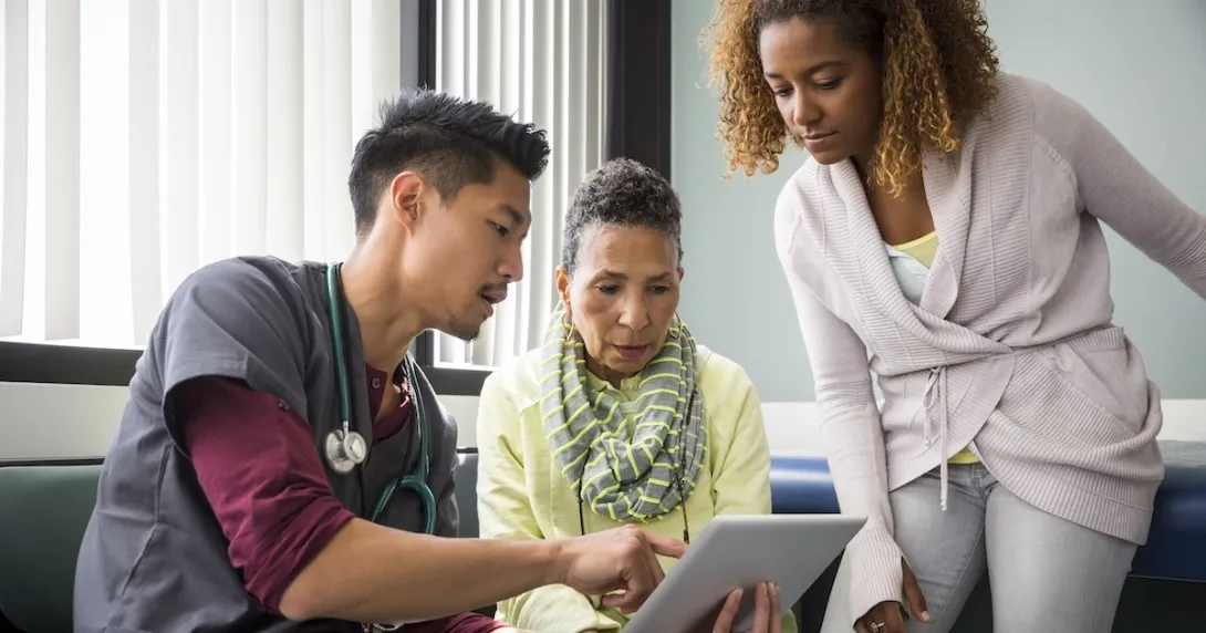 Healthcare professional review patient chart with two people
Healthcare professional review patient chart with two people