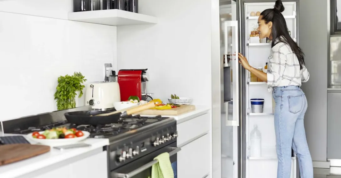 Person looking into a refrigerator
Person looking into a refrigerator