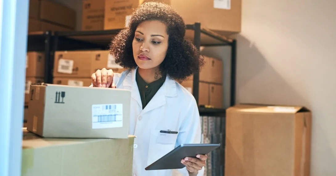 Pharmacist preparing to ship product Pharmacist preparing to ship product
