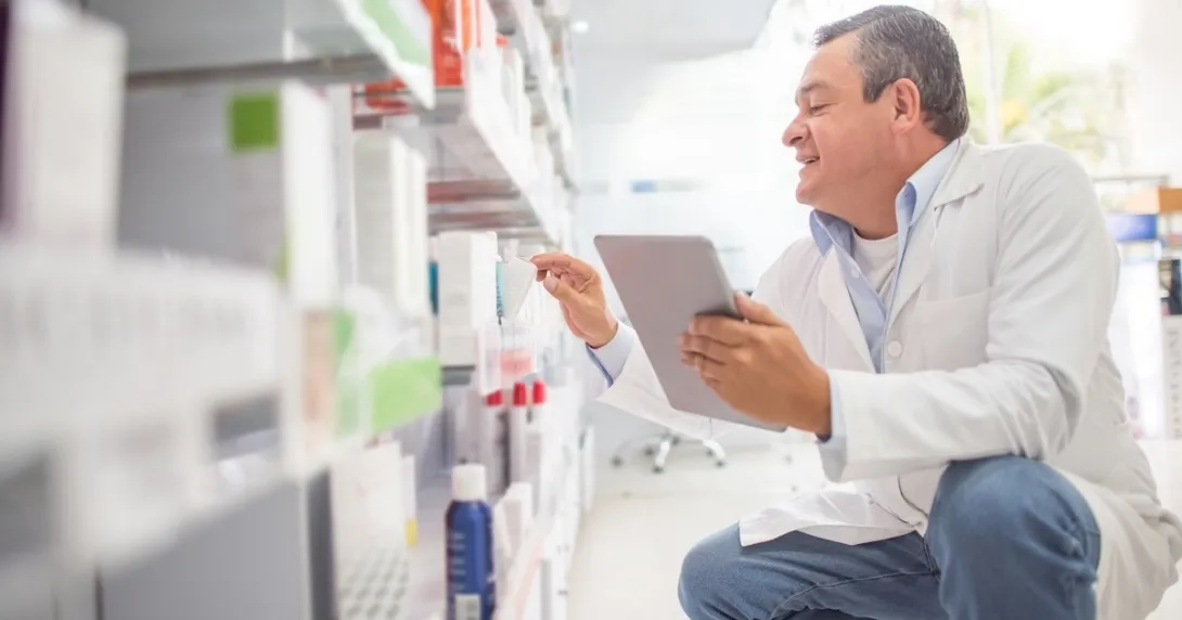 Pharmacist checking inventory