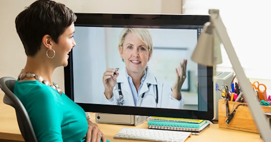 Pregnant women consulting with healthcare professional