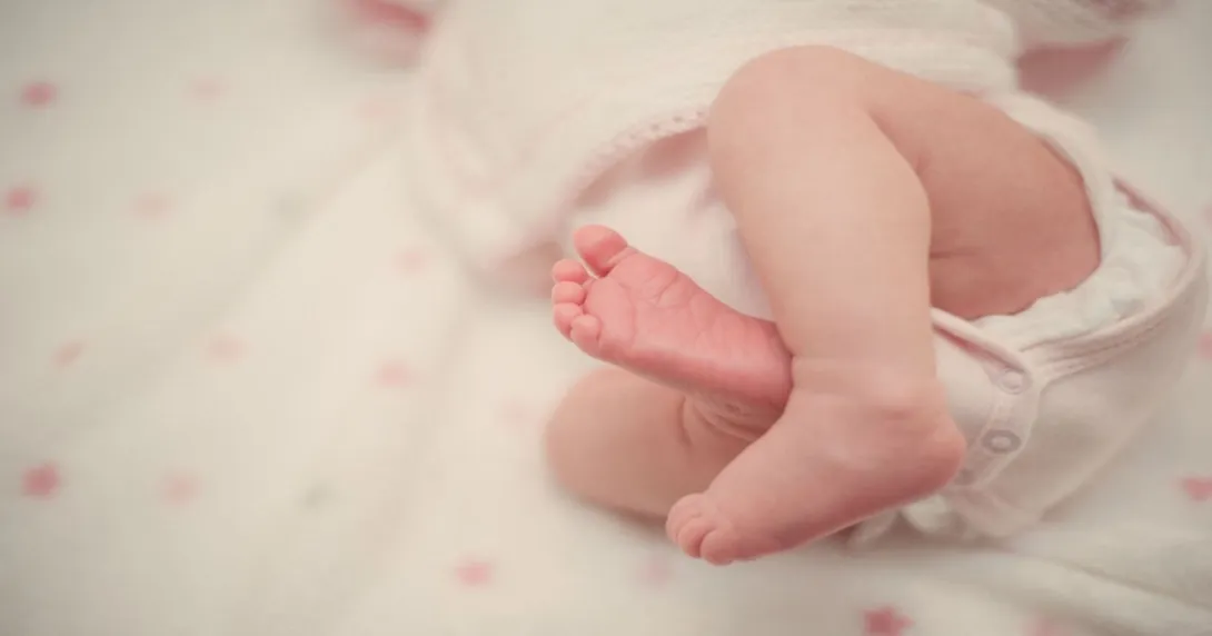 A baby in NICU bed