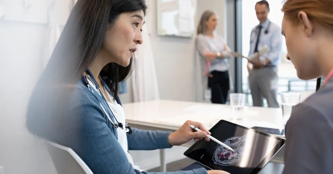 Doctors reviewing a brain scan