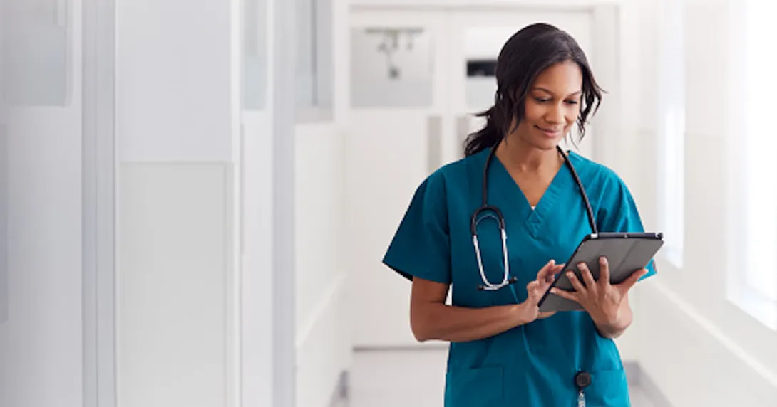 Healthcare provider standing in a hallway