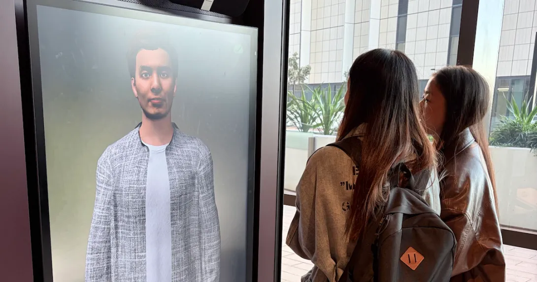 A pair of students interacting with an AI companion prototype