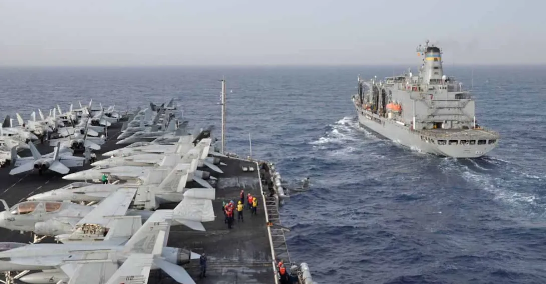Aircraft carrier USS Dwight D. Eisenhower (CVN 69) and Military Sealift Command fleet replenishment oiler USNS Kanawha (T-AO 196) participate in a replenishment-at-sea
