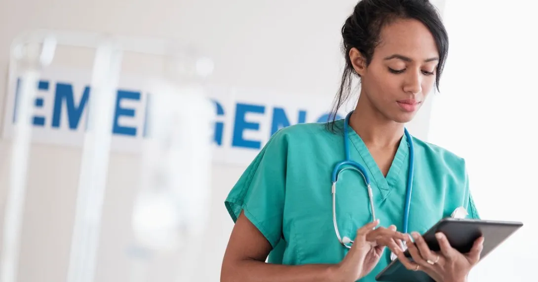 Healthcare professional looking at a tablet
