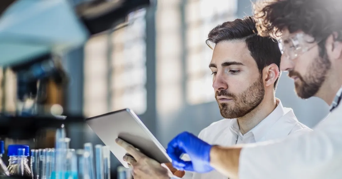 Two lab technicians at work