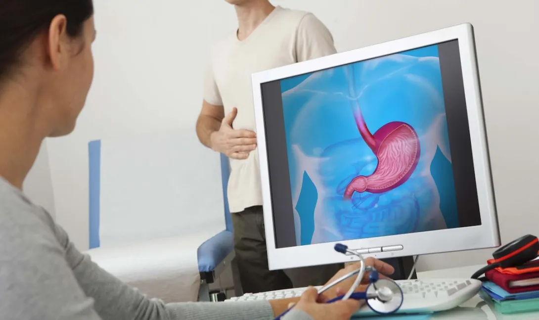 Gastroenterology exam with screen showing stomach