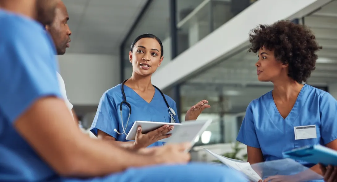 Healthcare providers sitting in a circle