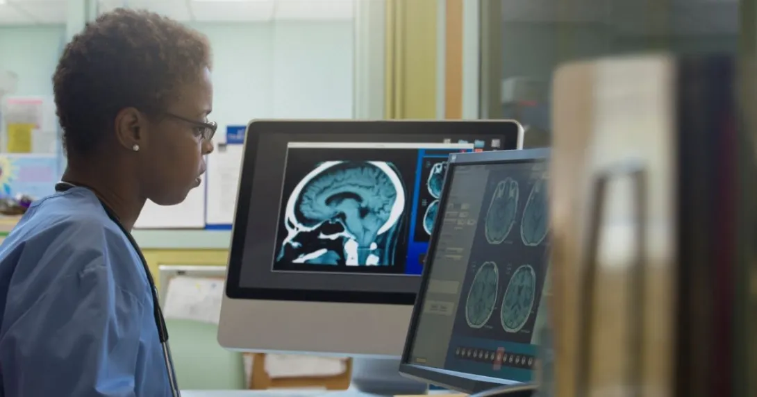 Person looking at computer monitors