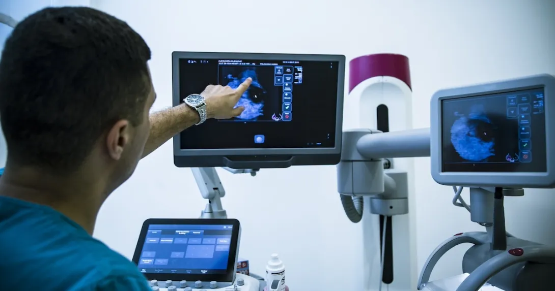 Technician looking at x-ray