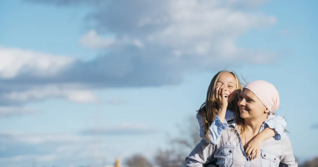 Person in a field with another person on their back