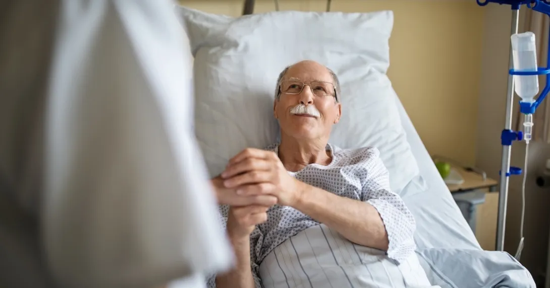 Healthcare professional consulting with patient in the hospital