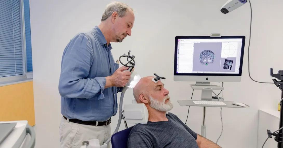 Trial overseer Professor Peter Nestor demonstrating the use of ultrasound in an Alzheimer's treatment session