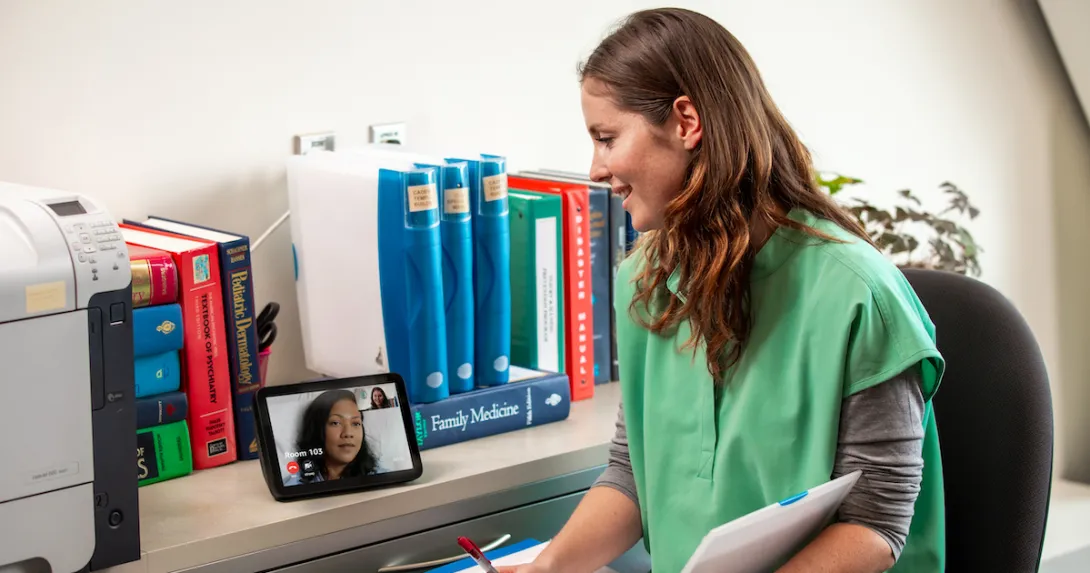 A provider talks to a patient using an Alexa-enabled device