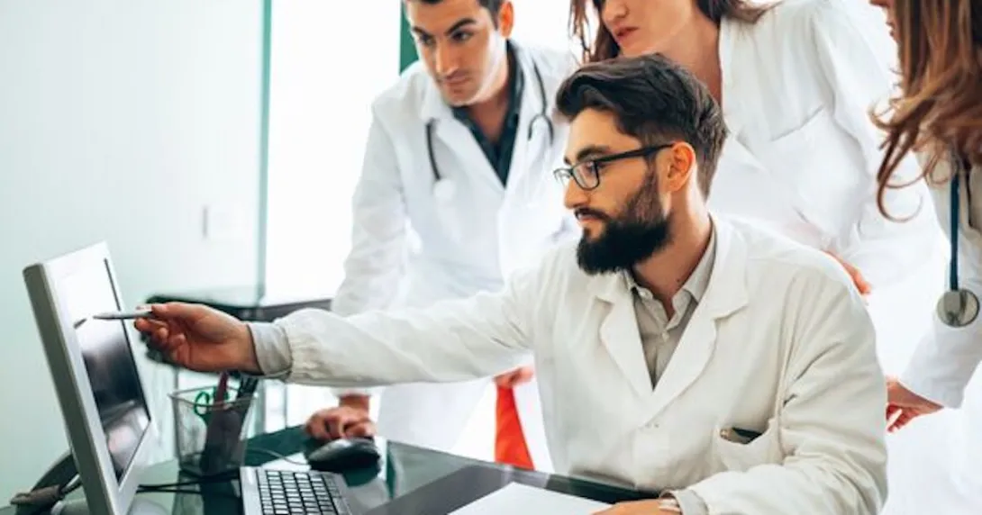 Clinicans looking at screen