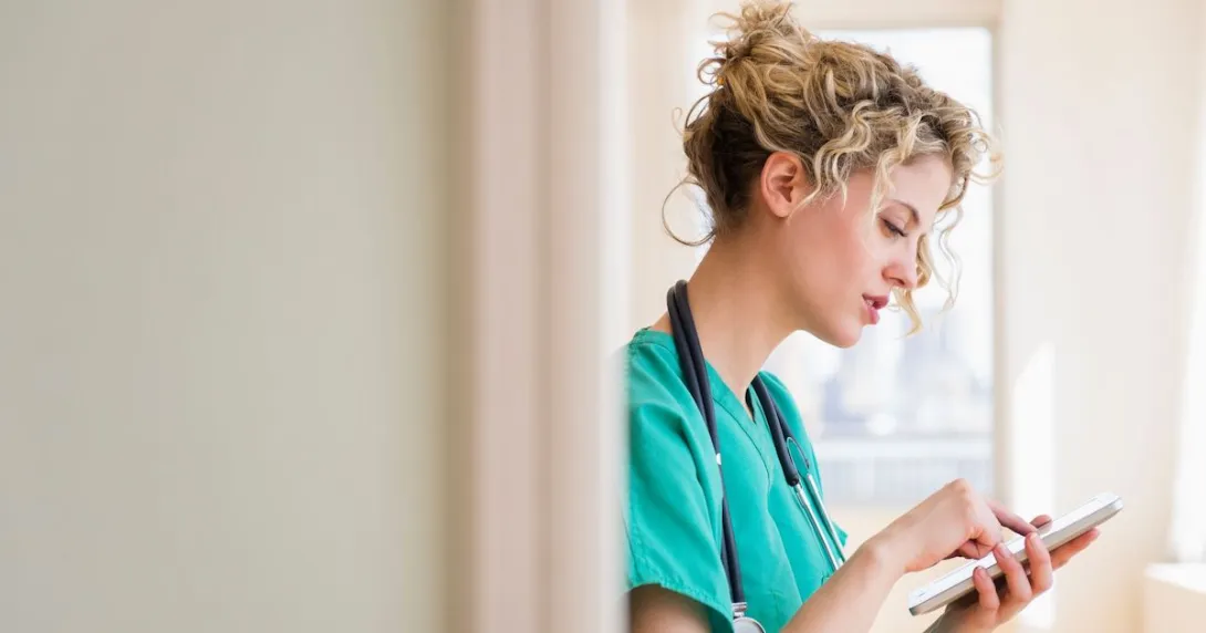 A nurse using her smartphone.