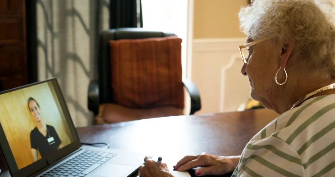 A person talking to a provider via a video call.