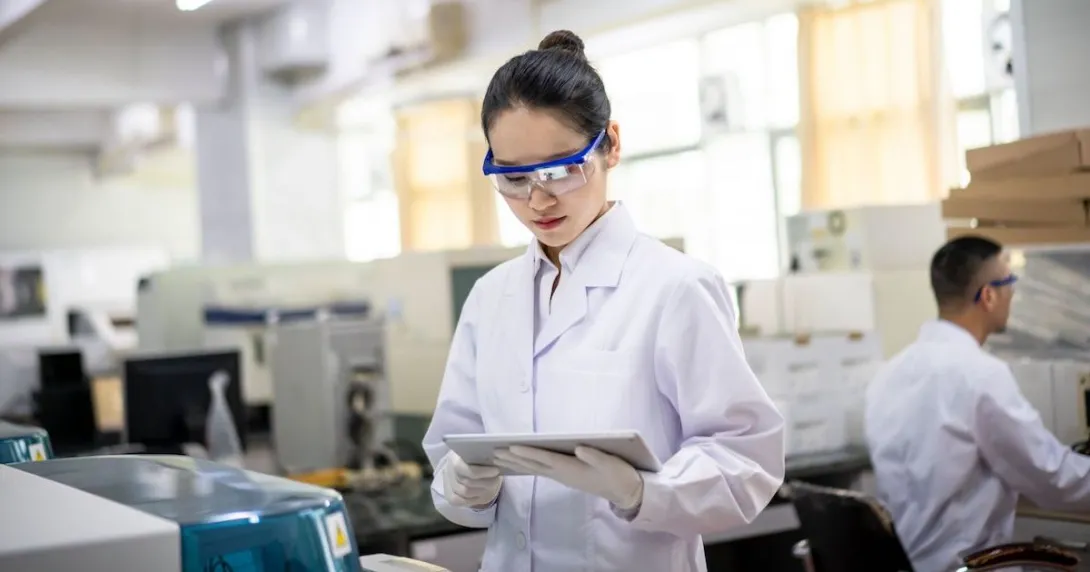 Researcher looking at a tablet