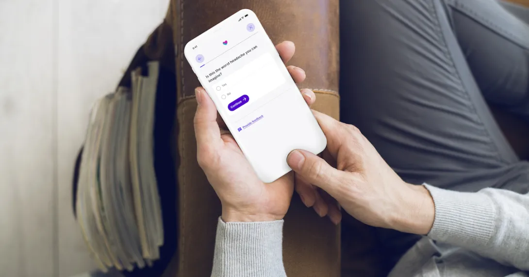 A close up of a person using Babylon's Symptom Checker on a smartphone
