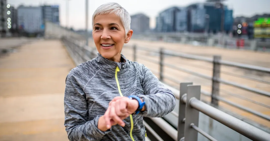 A person using a wearable while out on a run.