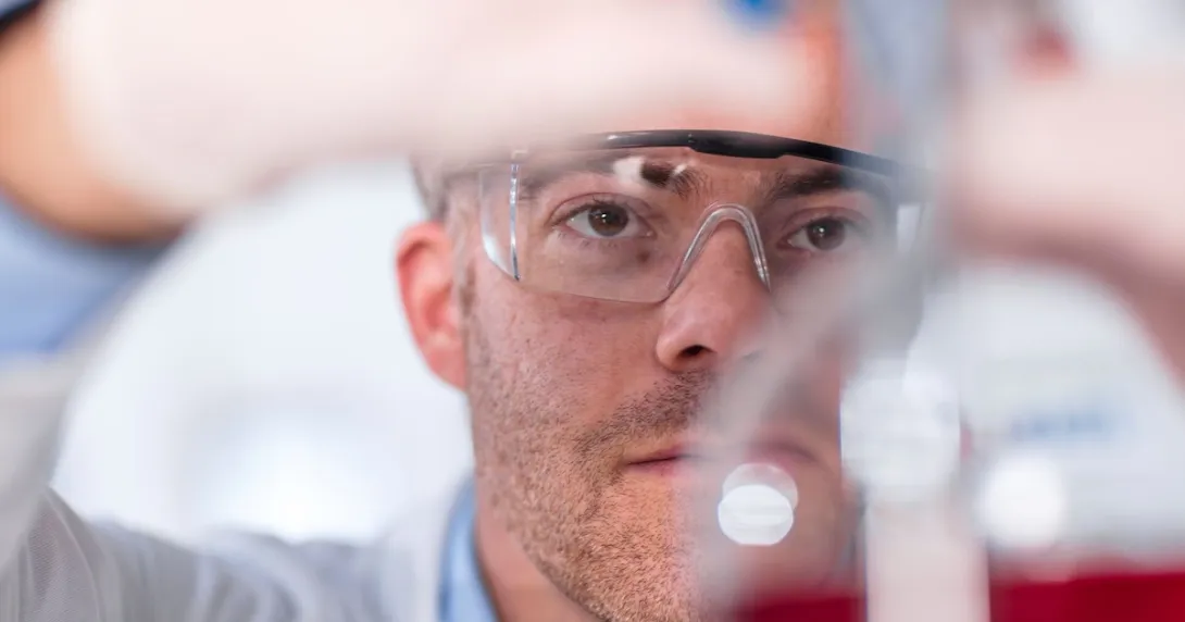 Scientist working with chemicals in a lab