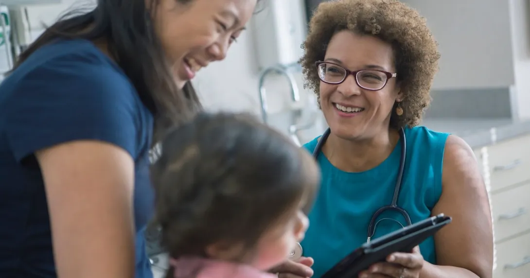 Healthcare provider with a patient and their caregiver