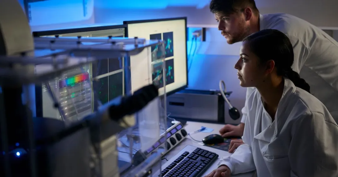 Healthcare providers sitting down and looking at a computer
