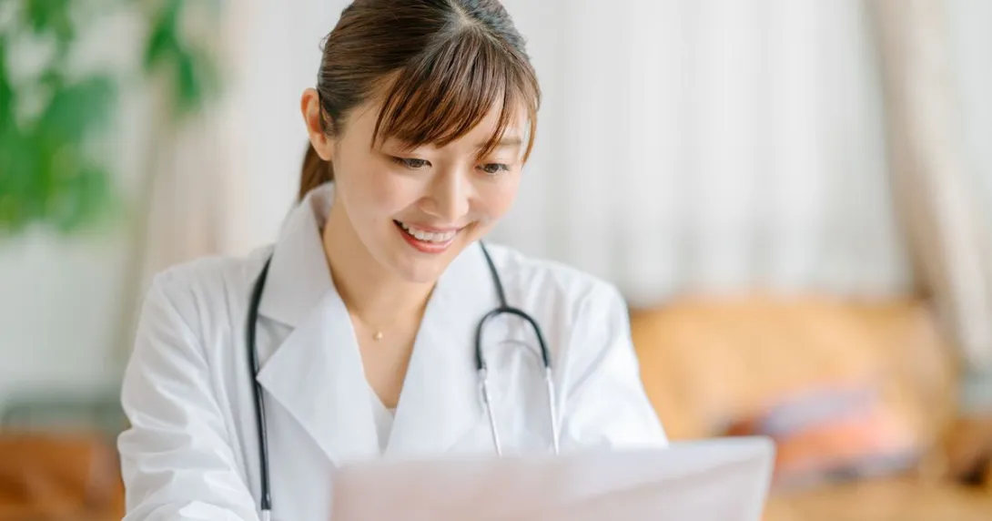 A doctor using a laptop computer