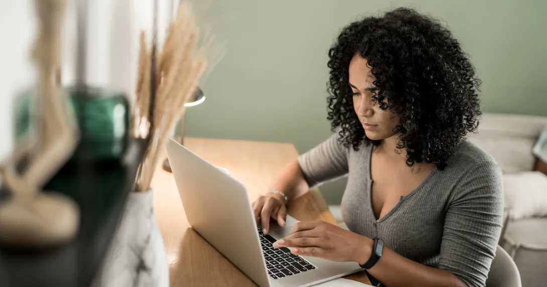 A person using a laptop.